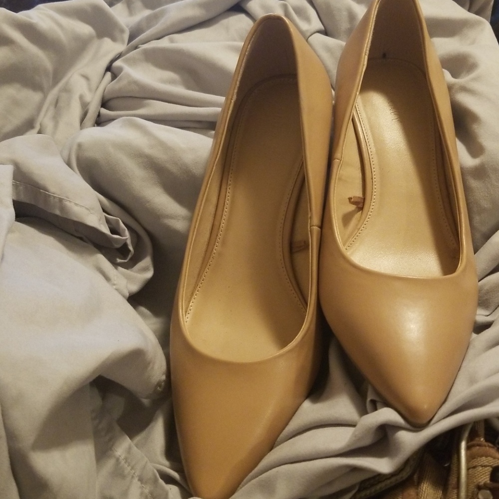 Nude 2 inch heels never worn. Minor flaw